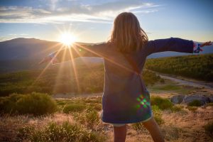 Girl hugging a sunset. Serenity, peace, mindfulness