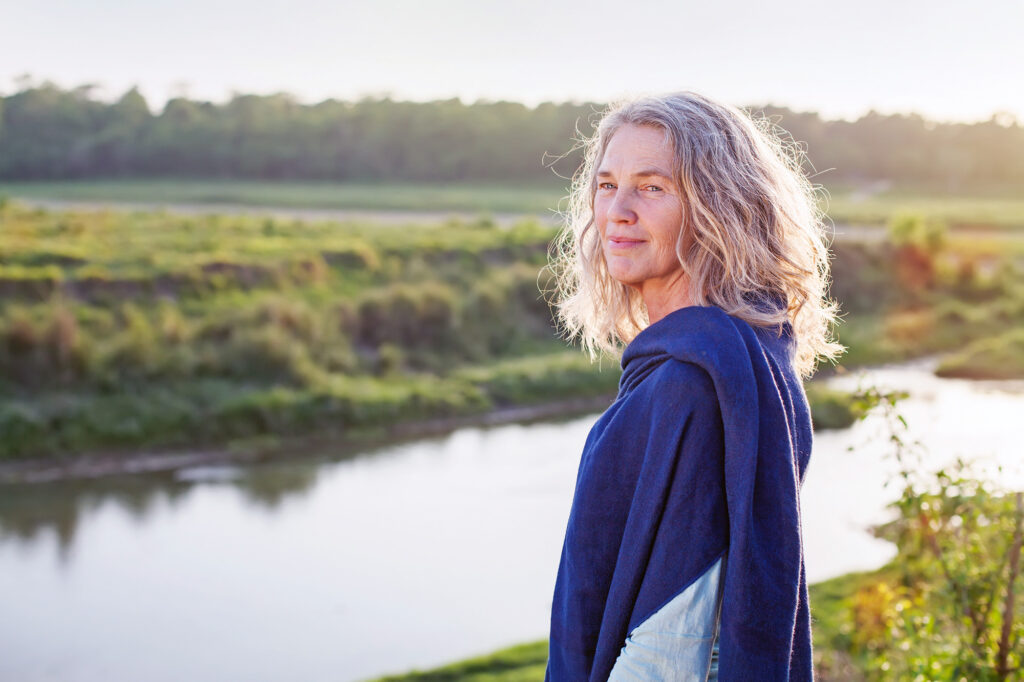 woman by the bank of a river